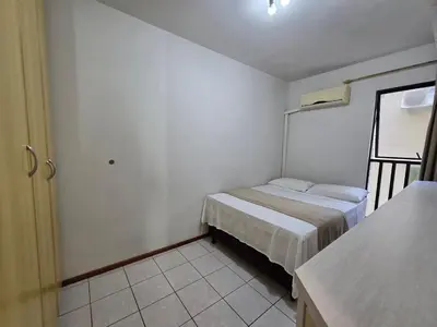 Uma cama ou camas num quarto em Apartamento quadra mar Meia Praia