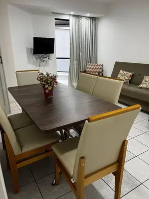 Uma televisão e/ou sistema de entretenimento em Apartamento quadra mar Meia Praia