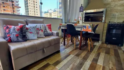 Uma área de estar em Apartamentos com 2 quartos na Praia de Itapema bairro Meia Praia