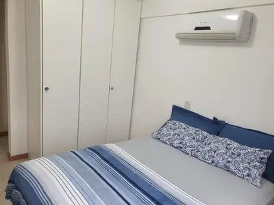 Uma cama ou camas num quarto em Cantinho Aconchegante Bombinhas