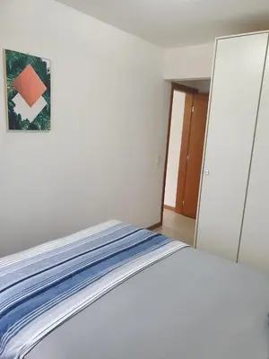 Uma cama ou camas num quarto em Cantinho Aconchegante Bombinhas