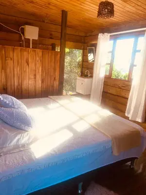 Uma cama ou camas num quarto em Praia de Palmas - Suíte 01