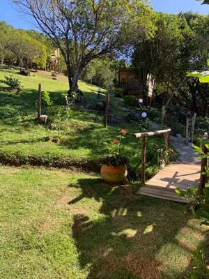 Um jardim no exterior de Praia de Palmas - Suíte 01
