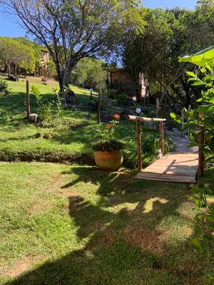 Um jardim no exterior de Praia de Palmas - Suíte 01