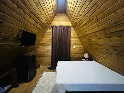 Uma televisão e/ou sistema de entretenimento em Praia de Palmas - Chalé