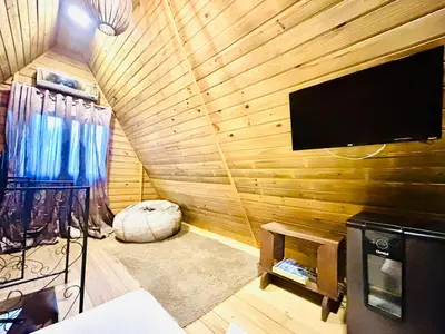 Uma televisão e/ou sistema de entretenimento em Praia de Palmas - Chalé