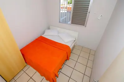 Uma cama ou camas num quarto em Residencial Primavera