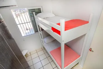 Uma cama ou camas num quarto em Residencial Primavera