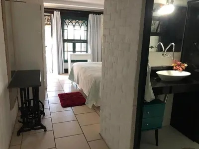 Uma cama ou camas num quarto em Linda Casa frente mar, pé na areia, Itapema SC, Ar, Wi-fi, Smart Tv