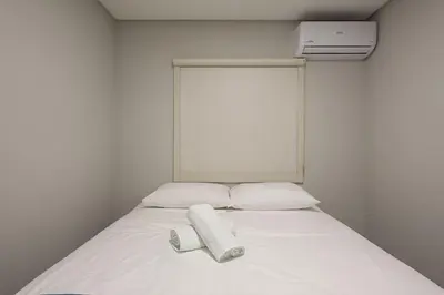 Uma cama ou camas num quarto em Apto 2Q c/ Garagem e churrasq. 450m do mar EAN503