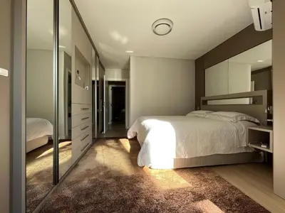 Uma cama ou camas num quarto em Beira Mar com Excelente Localização