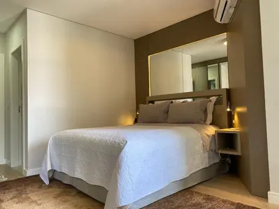 Uma cama ou camas num quarto em Beira Mar com Excelente Localização